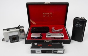 MINOLTA: Four miniature cameras - one c. 1966 Minolta-16 MG in collector's box with leather case, chain, two lens filters, and flash unit, together with one c. 1977 Minolta Autopak 500, one c. 1978 Minolta Pocket Autopak 250 in leather pouch, and one c. 1979 Minolta Autopak 460Tx. (4 cameras)