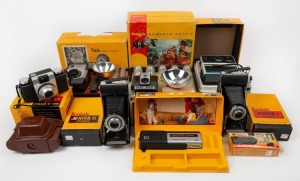 KODAK: Eight cameras, all of them in maker's boxes - one Brownie Bull's-Eye Flash Outfit with flash unit and eight flash bulbs, one Brownie Hawkeye Flash Model Outfit with instruction booklet, flash unit, eight flash bulbs, and two batteries, one EK4 with wrist strap, one Funtime 35, one Junior I, one Junior II, one Pony II with leather case, instruction booklet, and wrist strap, and one Sport Camera. (8 cameras)