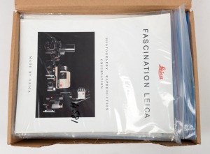 LEITZ: One A4 archive box containing sixty Leitz product brochures and sales guides, each sealed in a plastic sleeve. (60 items)