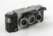 WHITE: Stereo Realist Model 1041 stereo camera [#A41427], c. 1950, with dual f3.5 lenses. Unusual design with viewfinder at bottom of camera and integrated flip-up lens cap.
