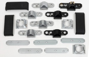 ASAHI KOGAKU: An accumulation of eighteen spare Pentax camera parts, including black and chrome top plates, bottom plates, back elements, etc. (18 items)