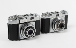 ZEISS IKON: Two c. 1954 rangefinder cameras - one Contina IIa 527/24 with Novicar 45mm f2.8 lens and Prontor-SVS shutter, and one Contina Ia 526/24 with Novar 45mm f3.5 lens and Prontor SVS shutter. (2 cameras)