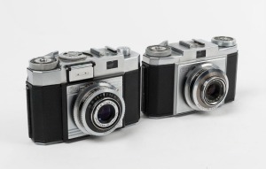 ZEISS IKON: Two c. 1954 rangefinder cameras - one Contina IIa 527/24 with Novicar 45mm f2.8 lens and Prontor-SVS shutter, and one Contina Ia 526/24 with Novar 45mm f3.5 lens and Prontor SVS shutter. (2 cameras)
