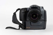 MINOLTA: RD-175 SLR camera [#13707010], c. 1995, with AF Zoom 24-85mm f3.5-4.5 lens [#21692210], together with front lens cap, strap, lens hood, power cable, instruction booklet, and software floppy disks. One of the first digital SLR cameras ever produce - 3