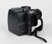 MINOLTA: RD-175 SLR camera [#13707010], c. 1995, with AF Zoom 24-85mm f3.5-4.5 lens [#21692210], together with front lens cap, strap, lens hood, power cable, instruction booklet, and software floppy disks. One of the first digital SLR cameras ever produce - 4