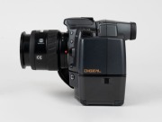 MINOLTA: RD-175 SLR camera [#13707010], c. 1995, with AF Zoom 24-85mm f3.5-4.5 lens [#21692210], together with front lens cap, strap, lens hood, power cable, instruction booklet, and software floppy disks. One of the first digital SLR cameras ever produce - 5