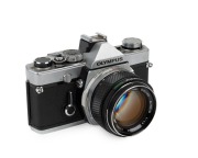 OLYMPUS: 1972 chrome-body Olympus M-1 SLR camera [#116270] with OM-System Auto-S 50mm f1.4 lens [#136192].