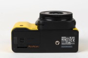 ASAHI KOGAKU: 2012 yellow-body Pentax K-01 digital camera [#4308569], with SMC Pentax-DA XS 40mm f2.8 lens, together with power pack. Camera base bears a print of the signature of Australian industrial designer Marc Newson, responsible for the camera's un - 5