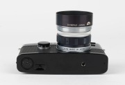 OLYMPUS: Black-body Pen FT half-frame SLR camera [#329944], c. 1967, with D. Zuiko Auto-S 38mm f2.8 lens [#100904] and Olympus S-45 lens hood. - 5