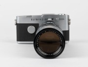 OLYMPUS: Olympus Pen FT half-frame SLR camera [#317899], c. 1967, with rare Zuiko Zoom 100-200mm f5 lens [#106452]. - 2