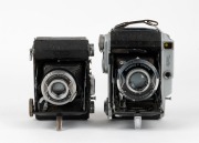 MINOLTA: Two vertical-folding cameras - one 1935-type Semi Minolta I with Coronar 75mm f4.5 lens [#71100] and Crown shutter, and one Auto Semi vertical-folding camera [#8972], c. 1937, with Promar 75mm f3.5 lens [#51583] and Crown Rapid shutter. (2 camera - 2