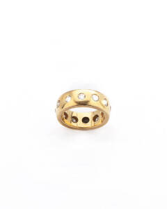 RING: 18ct yellow gold diamond band ring. 12.13 grams.