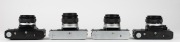 OLYMPUS: Four c. 1970s SLR cameras - one Olympus OM-1 [#527710] with G. Zuiko Auto-S 50mm f1.4 lens [#264437], one Olympus OM-1 MD [#860689] with G. Zuiko Auto-S 50mm f1.4 lens [#350643], one black-body Olympus OM-10 [#1646098] with Zuiko Auto-S 50mm f1.8 - 5