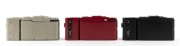 OLYMPUS: Three c. 1980 Olympus XA-2 compact cameras with D. Zuiko 35mm f3.5 lenses and A11 flash attachments - one in black [#5734551], one in cherry red [#5143858], and one in grey [#4785201]. (3 cameras) - 3