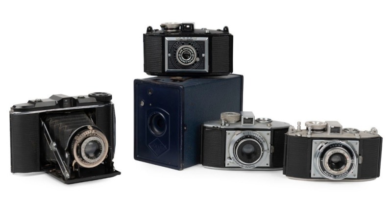 AGFA: Five c. 1930s cameras - one Schulprämie box camera, originally intended as an award to the highest-performing school students in Germany, together with one black-body Isorette with Apotar 85mm f4.5 lens [#658731], one 1937-type black-body Karat 6.3