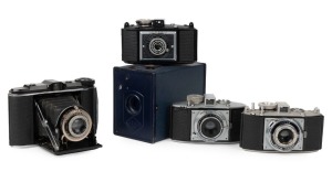 AGFA: Five c. 1930s cameras - one Schulprämie box camera, originally intended as an award to the highest-performing school students in Germany, together with one black-body Isorette with Apotar 85mm f4.5 lens [#658731], one 1937-type black-body Karat 6.3 