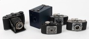 AGFA: Five c. 1930s cameras - one Schulprämie box camera, originally intended as an award to the highest-performing school students in Germany, together with one black-body Isorette with Apotar 85mm f4.5 lens [#658731], one 1937-type black-body Karat 6.3 - 2