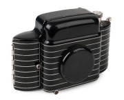 KODAK: Circa 1936 Bantam Special 828 film camera [#10294], with Ektar 45mm f2 lens and Compur-Rapid shutter. Much admired for its black and silver Art Deco&nbsp;styling.