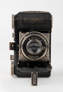 KODAK: Circa 1934 type 117 Retina I vertical-folding camera [#450615] in black-lacquer finish, with Xenar 50mm f3.5 lens [#688403] and Compur shutter. - 2