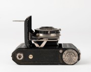 KODAK: Circa 1934 type 117 Retina I vertical-folding camera [#450615] in black-lacquer finish, with Xenar 50mm f3.5 lens [#688403] and Compur shutter. - 4
