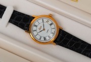 LEITZ: Swiss-made, fully-jeweled Leica gold-plated wristwatch with stainless-steel back and reptile-skin strap, in white and gold presentation box with warranty card and cardboard protective sleeve. - 2