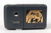 RIKEN: Limited-edition 'Principality of Zeon' DC-3G digital camera [#300246], c. 1998, in grey with Ricoh 5-15mm f3.8 lens together with maker's box, data cable, and SmartMedia card. Featuring gold imagery from the Gundam Japanese animation franchise, the - 3