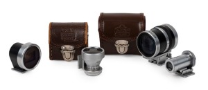 NIPPON KOGAKU: Four viewfinders - one black and chrome type 1 35mm-135mm Varifocal Zoom finder [#336974] in maker's leather case, one chrome 28mm optical finder in maker's leather case, one black and chrome 25mm optical finder, and one chrome 85mm optical