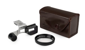 NIPPON KOGAKU: Circa 1957 2.6-1.5ft close-up attachment kit for Nikon SP, comprising close-focusing device in black and chrome, black 50mm f1.4 lens [#50478], maker's leather case, and instruction sheet.