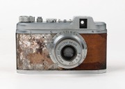 RIKEN: Rare c. 1941 Ricohl Mod. 1 127 film camera [#3600],&nbsp;featuring unusual brown leather covering, with Gokoku Anastigmat 50mm f3.5 lens [#11923]. One of only approximately 1500 believed to have been produced. - 2