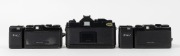 CHINON: Three c. 1980 35mm cameras - one&nbsp;CM-4s SLR&nbsp;with Auto Chinon 50mm f1.9 lens [#752977], together with two&nbsp;Bellami compact cameras [#237164 & #184665], both with wrist straps and with one maker's box/instruction booklet/case present. (3 cameras) - 2