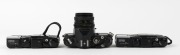 CHINON: Three c. 1980 35mm cameras - one&nbsp;CM-4s SLR&nbsp;with Auto Chinon 50mm f1.9 lens [#752977], together with two&nbsp;Bellami compact cameras [#237164 & #184665], both with wrist straps and with one maker's box/instruction booklet/case present. (3 cameras) - 3