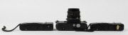 CHINON: Three c. 1980 35mm cameras - one&nbsp;CM-4s SLR&nbsp;with Auto Chinon 50mm f1.9 lens [#752977], together with two&nbsp;Bellami compact cameras [#237164 & #184665], both with wrist straps and with one maker's box/instruction booklet/case present. (3 cameras) - 4