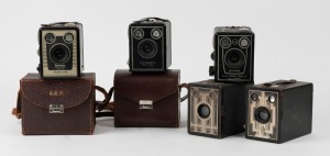 KODAK: Five c. late 1930s box cameras - one Six-16 Brownie with metal Art Deco front plate, one North American-market Six-20 Brownie Junior, one Six-20 Brownie Model D, one Six-20 Brownie Model C in leather case, and one Six-20 Brownie Model D with flash 