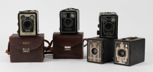 KODAK: Five c. late 1930s box cameras - one Six-16 Brownie with metal Art Deco front plate, one North American-market Six-20 Brownie Junior, one Six-20 Brownie Model D, one Six-20 Brownie Model C in leather case, and one Six-20 Brownie Model D with flash contacts in leather case. (5 cameras)