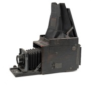GRAFLEX: Revolving Back Auto Graflex plate camera [#130296], c. 1909, with Tessar 1c 5x7 lens [#3215959] and film pack adapter attachment. - 2