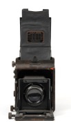 GRAFLEX: Revolving Back Auto Graflex plate camera [#130296], c. 1909, with Tessar 1c 5x7 lens [#3215959] and film pack adapter attachment. - 3