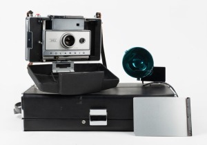 POLAROID: Circa 1969 Polaroid Automatic 350 Land Camera instant film camera with Zeiss Ikon rangefinder and wrist strap, in lined leather case with Polaroid Model 268 flash unit and instruction booklets.