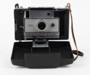 POLAROID: Circa 1969 Polaroid Automatic 350 Land Camera instant film camera with Zeiss Ikon rangefinder and wrist strap, in lined leather case with Polaroid Model 268 flash unit and instruction booklets. - 2