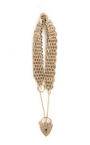 GATELINK BRACELET: 9ct gold with heart lock. 23 grams