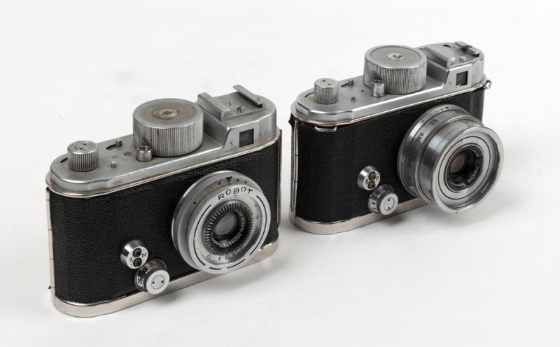 BERNING ROBOT: Two c. 1951 Robot IIa 35mm cartridge cameras - one  [#C106383] with Schneider-Kreuznach Xenar 38mm f2.8 lens [#3009355], and  one [#J134485] with Carl Zeiss Jena Tessar 3.25mm f2.8 lens [#2028874]. (2  cameras)