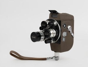 ARCO: Circa 1956 Arco Eight 8mm movie camera [#6148], with ¼"/½"/1½" f1.4 lenses in triple-turret with matching metal lens caps and wrist strap attachment.