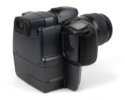 MINOLTA: RD-175 SLR camera [#16801446], c. 1995, with Maxxum AF Zoom Xi 35-200mm f4.5-5.6 lens [#22129695], together with lithium battery. One of the first digital SLR cameras ever produced. - 2