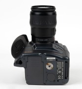 MINOLTA: RD-175 SLR camera [#16801446], c. 1995, with Maxxum AF Zoom Xi 35-200mm f4.5-5.6 lens [#22129695], together with lithium battery. One of the first digital SLR cameras ever produced. - 4