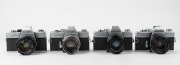 MINOLTA: Four c. 1970s black and chrome SLR cameras - one SRT-200 [#7335848] with MC Rokkor-PF 50mm f2 lens, one SRT MC-II [#9040109] with MC Rokkor-PF 50mm f1.7 lens, one SRT-101 [#1478374] with MC Rokkor-PG 50mm f1.4 lens, and one SRT-101 [#1743742] wit - 3
