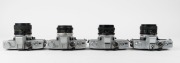 MINOLTA: Four c. 1970s black and chrome SLR cameras - one SRT-200 [#7335848] with MC Rokkor-PF 50mm f2 lens, one SRT MC-II [#9040109] with MC Rokkor-PF 50mm f1.7 lens, one SRT-101 [#1478374] with MC Rokkor-PG 50mm f1.4 lens, and one SRT-101 [#1743742] wit - 5