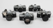 MINOLTA: Five c. 1960s SLR cameras - one SR-7 [#2138944] with front lens cap, one SR-3 [#1232460] with meter attachment and front lens cap, one SR-1 [#1239741] with SR-Meter&middot;2 and front lens cap, one SR-1 body [#2183819]&nbsp;with body cap, and one XG1 body [#