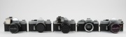 MINOLTA: Five c. 1960s SLR cameras - one SR-7 [#2138944] with front lens cap, one SR-3 [#1232460] with meter attachment and front lens cap, one SR-1 [#1239741] with SR-Meter&middot;2 and front lens cap, one SR-1 body [#2183819]&nbsp;with body cap, and one XG1 body [# - 2
