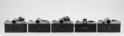 MINOLTA: Five c. 1960s SLR cameras - one SR-7 [#2138944] with front lens cap, one SR-3 [#1232460] with meter attachment and front lens cap, one SR-1 [#1239741] with SR-Meter&middot;2 and front lens cap, one SR-1 body [#2183819]&nbsp;with body cap, and one XG1 body [# - 3