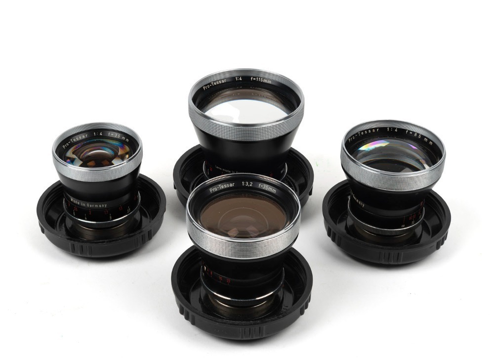 CARL ZEISS: Four c. 1950s Contaflex Pro-Tessar lenses in plastic