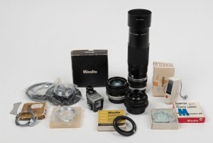 MINOLTA: Ten photography accessories - one Zoom Rokkor 100-200mm f5.6 lens with lens hood and rear cap, one MD Rokkor 45mm f2 lens with front and rear caps, one MC Rokkor-PF 55mm f1.9 lens with rear cap, one Slide Copier/Close Up Adapter Ring Kit in maker's box, four adapter rings in maker's boxes, one Duofit-S flashgun in maker's box, and one SR-1 S exposure meter attachment. (10 items)